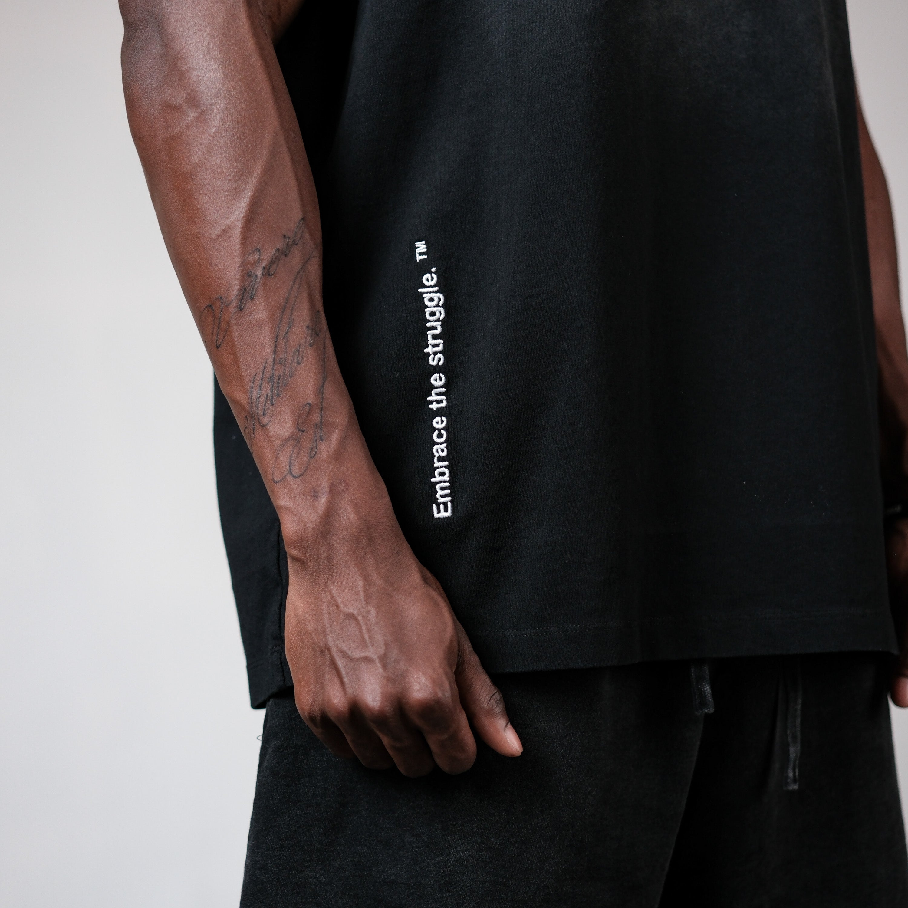 EMBRACE THE STRUGGLE SLEEVELESS TEE