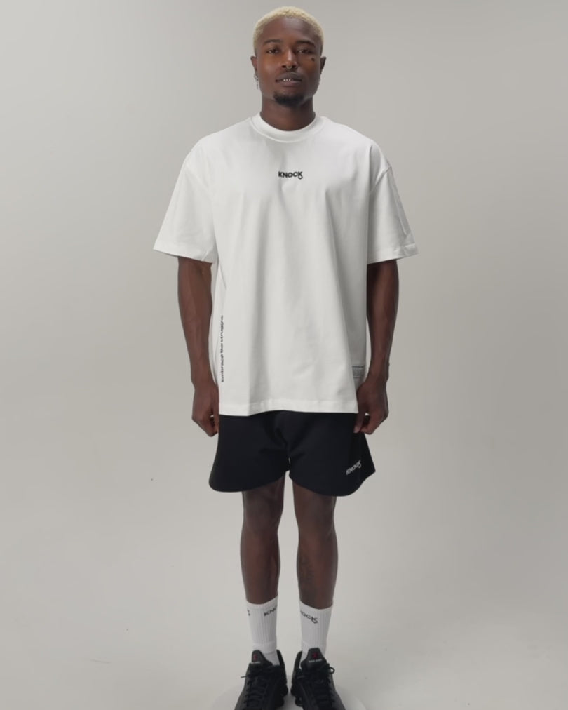 Load video: EMBRACE THE STRUGGLE OVERSIZED HEAVY TEE WHITE